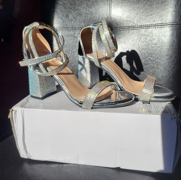 Gorgeous glam shoes. Silver, shiny, and waiting for your fabulous event.Size 6.5 - Picture 3 of 3